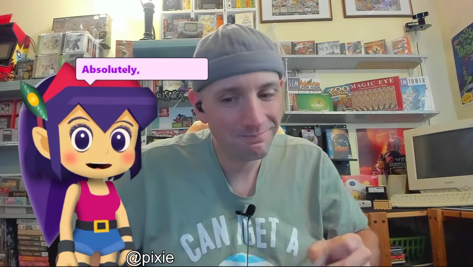 Nick Kilcoyne en su sala de streaming de estética noventera junto a Pixie, su copresentadora de IA animada, que habla dentro de un bocadillo de diálogo